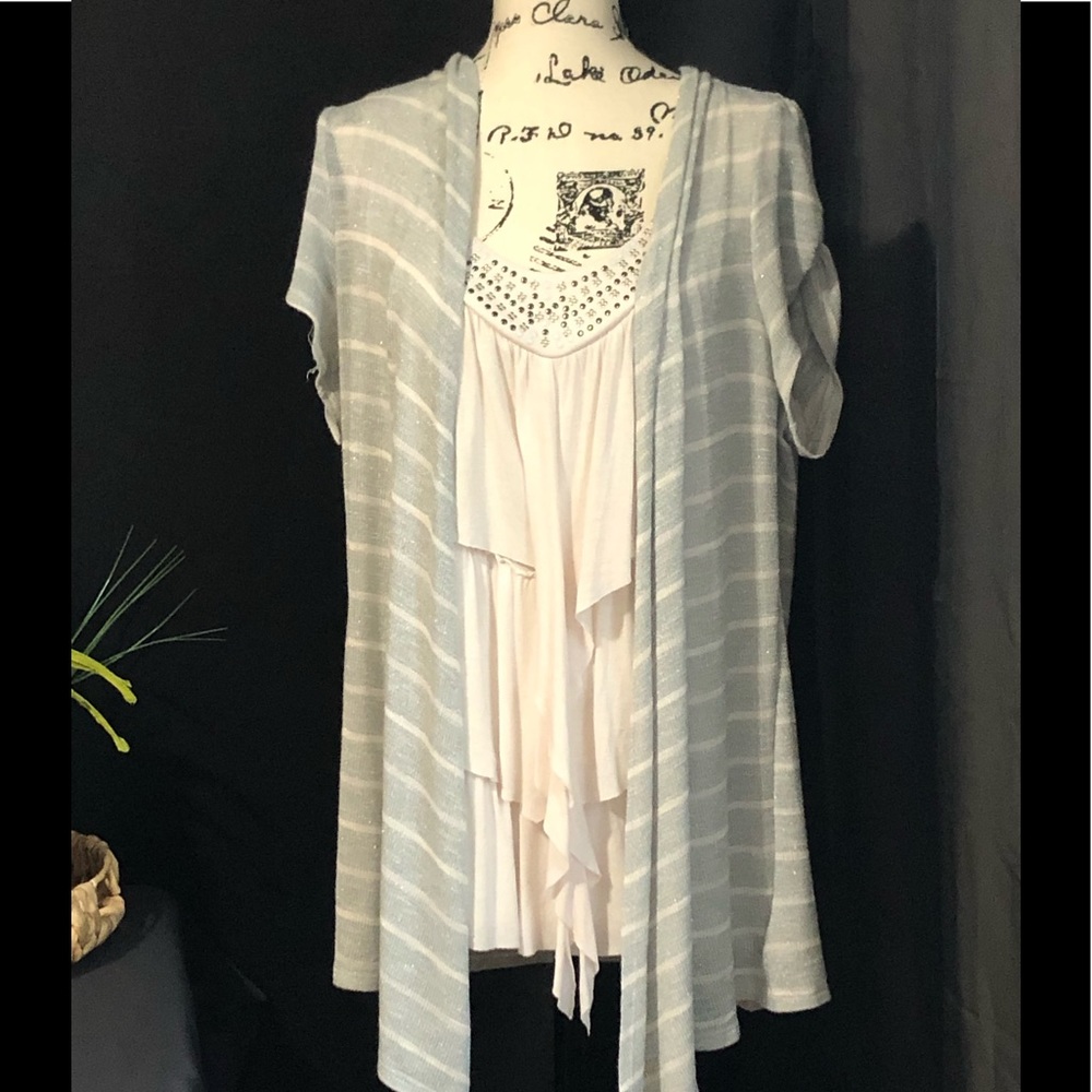 Like new blouse with beading at neckline.